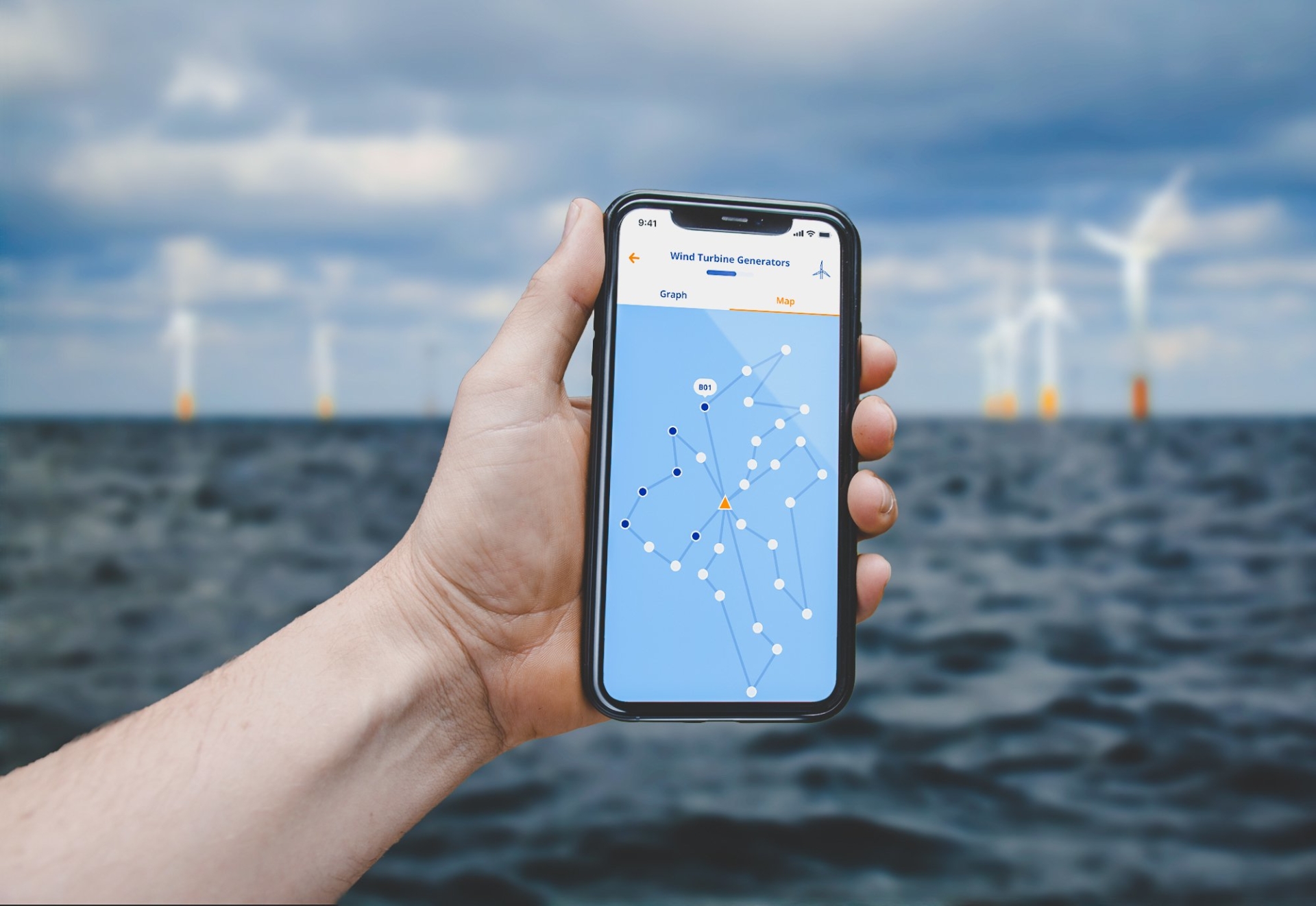 Photo of a hand holding the Van Oord app in front of a background of windturbines at sea